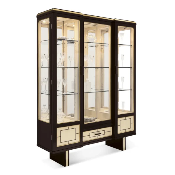 Maya display cabinet with pedestal base, dark wood with gold trim and glass shelves.