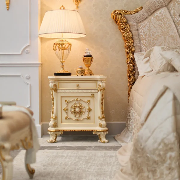 Nightstand, hand-carved in baroque style with gold details, beside the collection's bed
