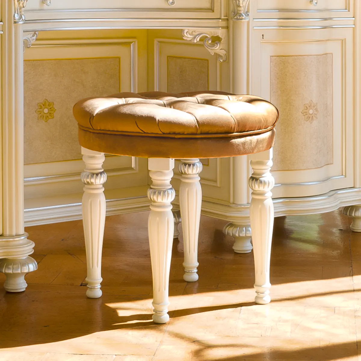 Eden Carved Pouf with Tufted Cushion Eden carved wood pouf with tufted leather cushion, luxury interior