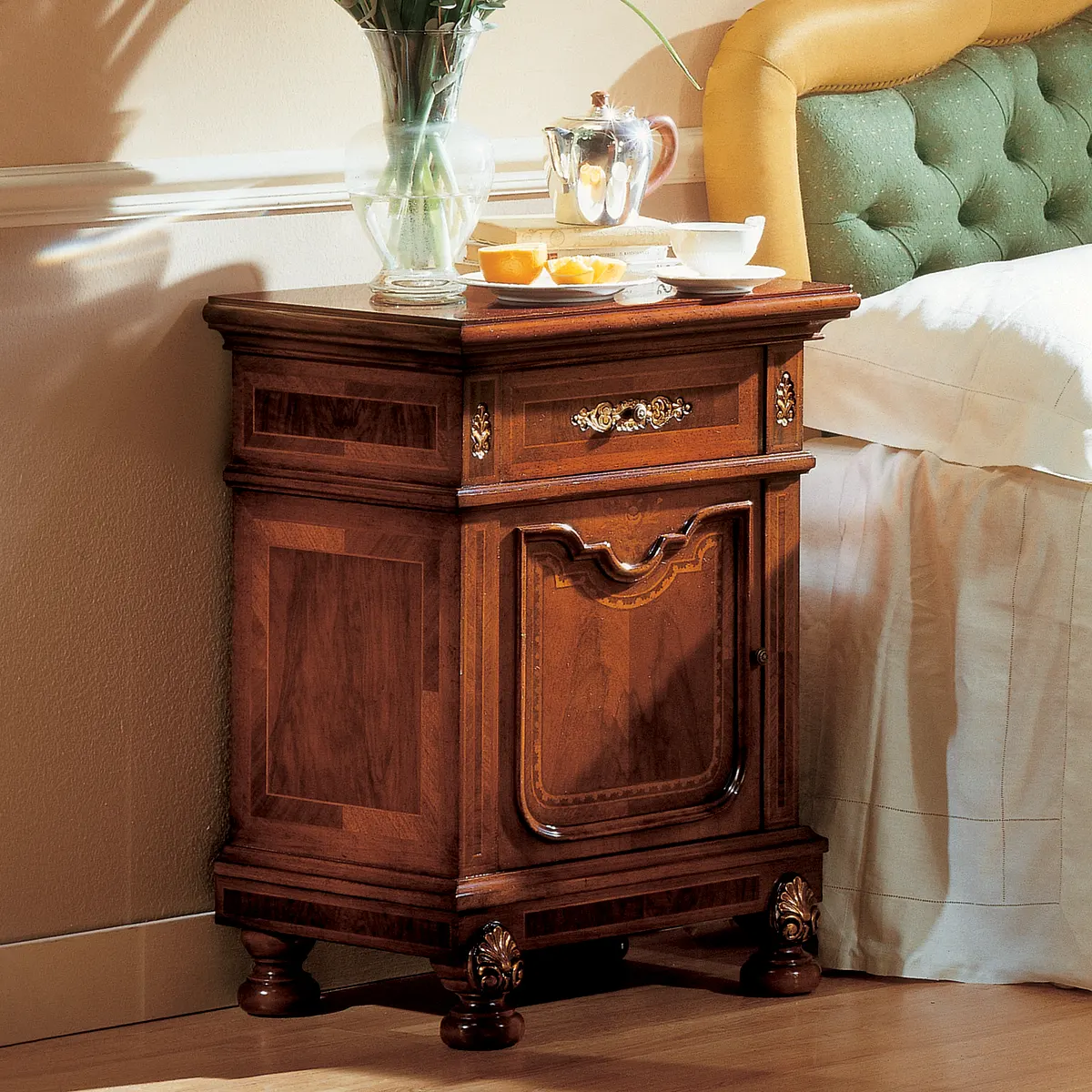 GRANDUCATO nightstand EN Granducato nightstand hand-carved, beside a luxury bed, Italian craftsmanship.