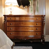 Louvre dresser in hand-carved wood, luxury Italian craftsmanship.