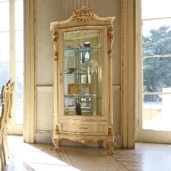 Louvre 1-door display cabinet in carved wood, compact and handcrafted, for showcasing with style.