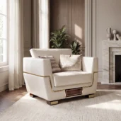 Close-up of Monte Carlo LUX armchair in cream leather with brass detailing, fireplace living room