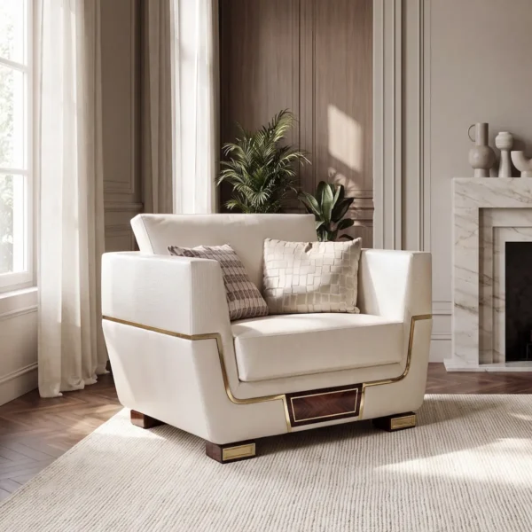 Close-up of Monte Carlo LUX armchair in cream leather with brass detailing, fireplace living room