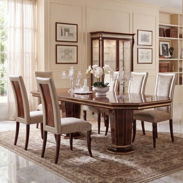 Monte Carlo LUX dining table in a dining room with framed architectural prints, luxury Italian decor