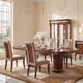 Monte Carlo LUX dining table in an elegant dining room with gold-trimmed wall paneling