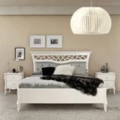 Monte Carlo bed in solid wood with ivory lacquer finish, bedroom with lake view.