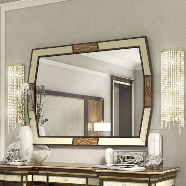 Monte Carlo LUX mirror in carved wood with decorative lighting and vases.