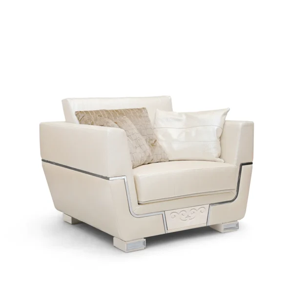 Monte Carlo armchair in cream leather with decorative cushions.