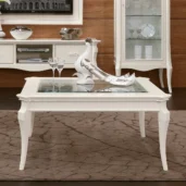 Monte Carlo white coffee table with glass top and decorative centerpiece.