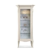 Monte Carlo 1-door display cabinet in solid wood with ivory lacquer finish and glass doors.
