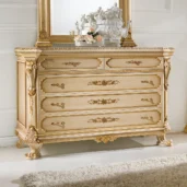 Prestige chest in carved wood with gold details.