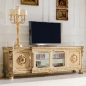 Prestige TV stand in carved wood with elegant lamp.