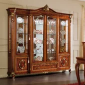 Prestige 4-door display cabinet in burl wood, living room setting.