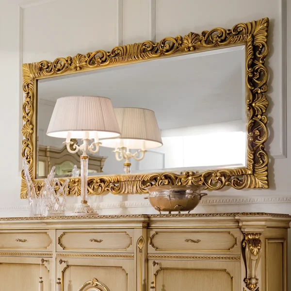 Prestige carved mirror with gold frame.