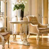 Prestige round tea table, classic setting with armchair.