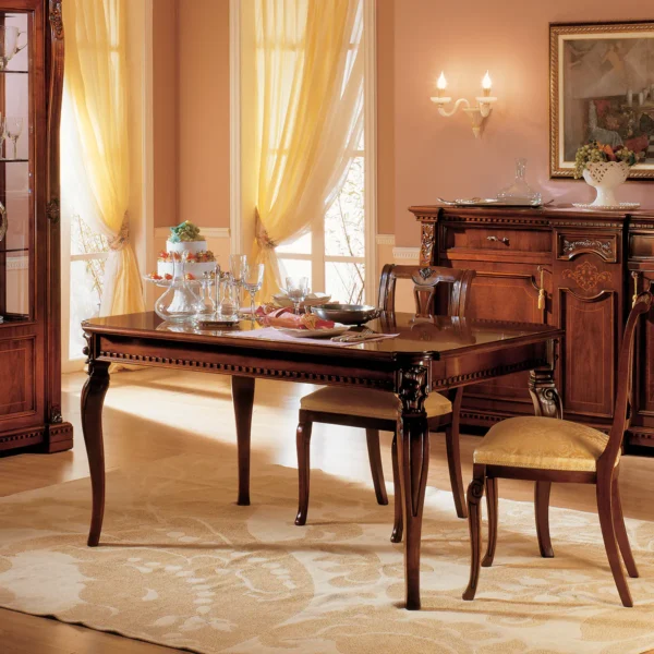 Elegant handcrafted Regina wooden dining table set in a luxurious villa interior, classic Italian design.