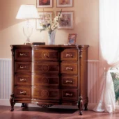 Luxurious handmade Royal dresser with intricate carvings, elegant decor, and a classic lamp in a sophisticated setting.