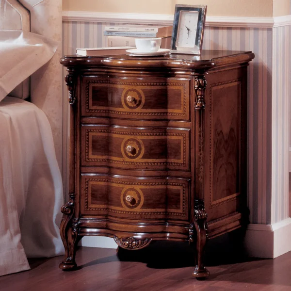 Elegant hand-carved Royal nightstand with intricate details, showcasing luxury Italian craftsmanship in a villa bedroom.