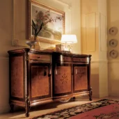 Handmade Italian Royal sideboard in a luxurious villa interior with elegant decor and ambient lighting.