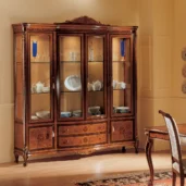 Royal display cabinet 4 doors showcasing fine china and crystal glassware in a luxury interior setting.