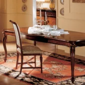 Royal large extendable dining table, closed position, in a luxurious villa dining room.