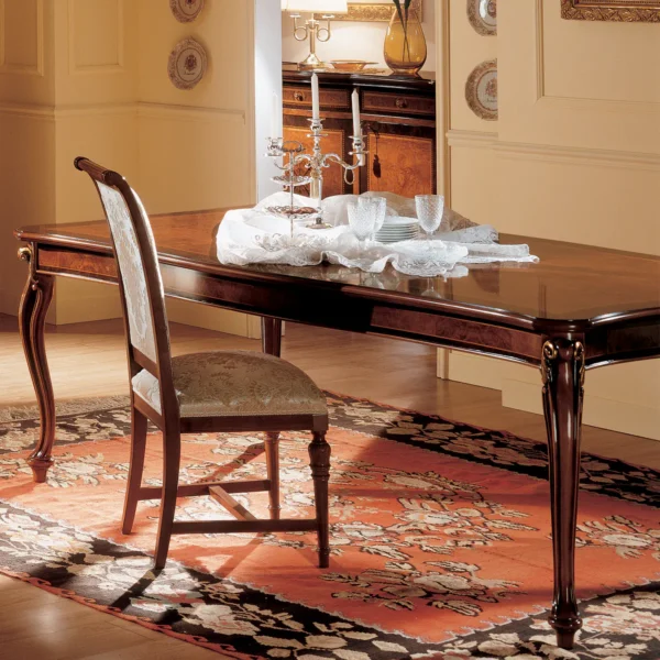 Royal large extendable dining table, closed position, in a luxurious villa dining room.