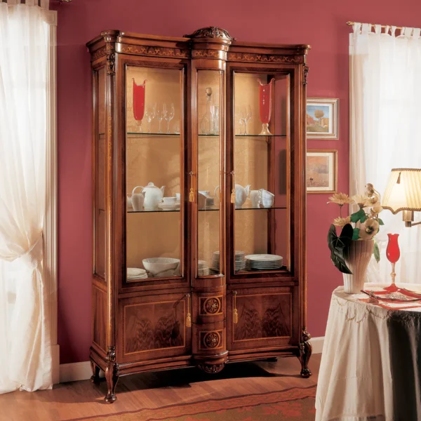 Elegant handcrafted Royal display cabinet in a luxurious villa dining room, featuring fine china and glassware.