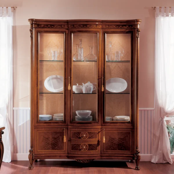 Handcrafted Italian Royal display cabinet with glass doors, showcasing elegant china and glassware.