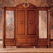 Elegant handcrafted Senator wardrobe with ornate carvings, ideal for luxury villa interiors.