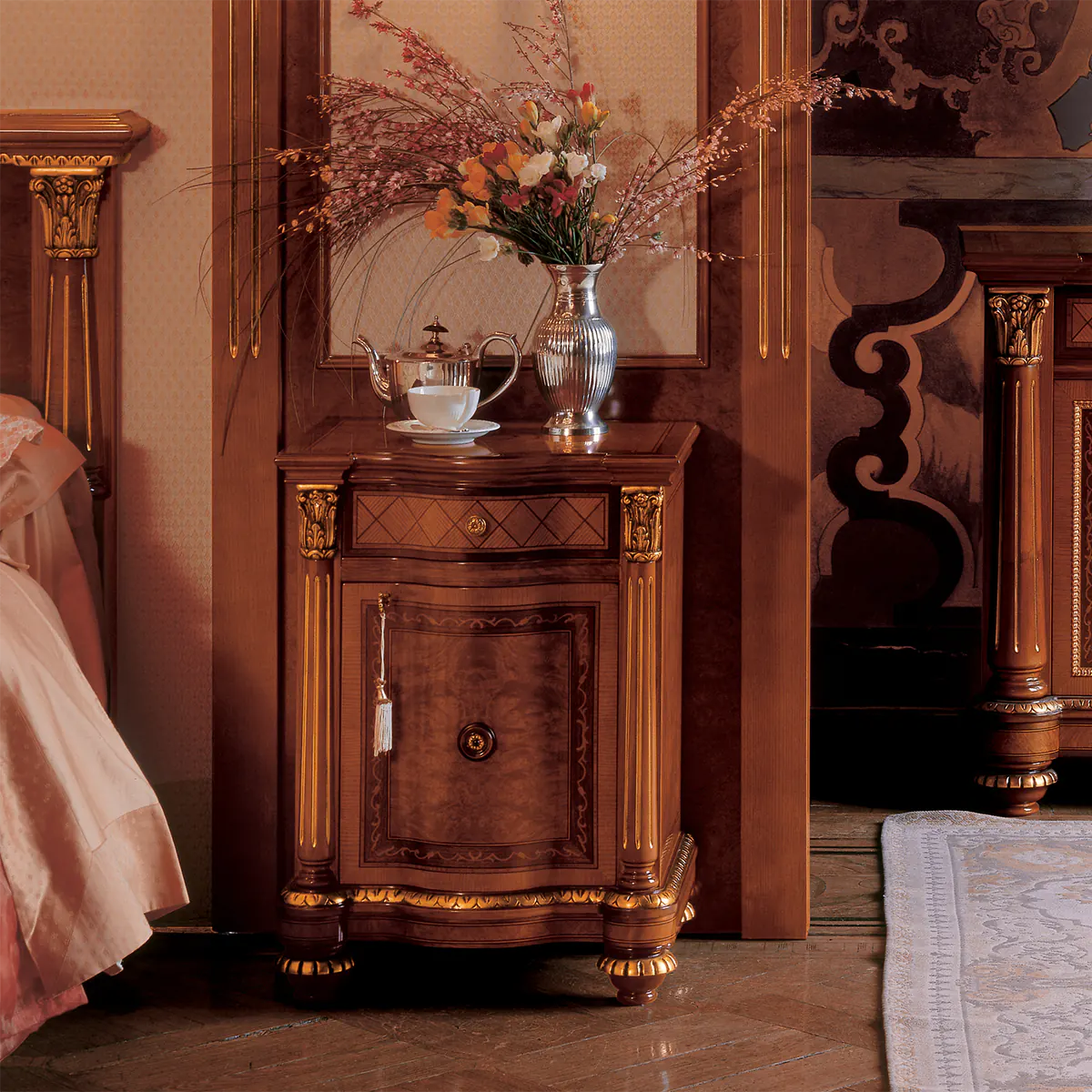 SENATOR nightstand Luxury handmade Italian Senator nightstand with ornate design, featuring a vase and teacup.