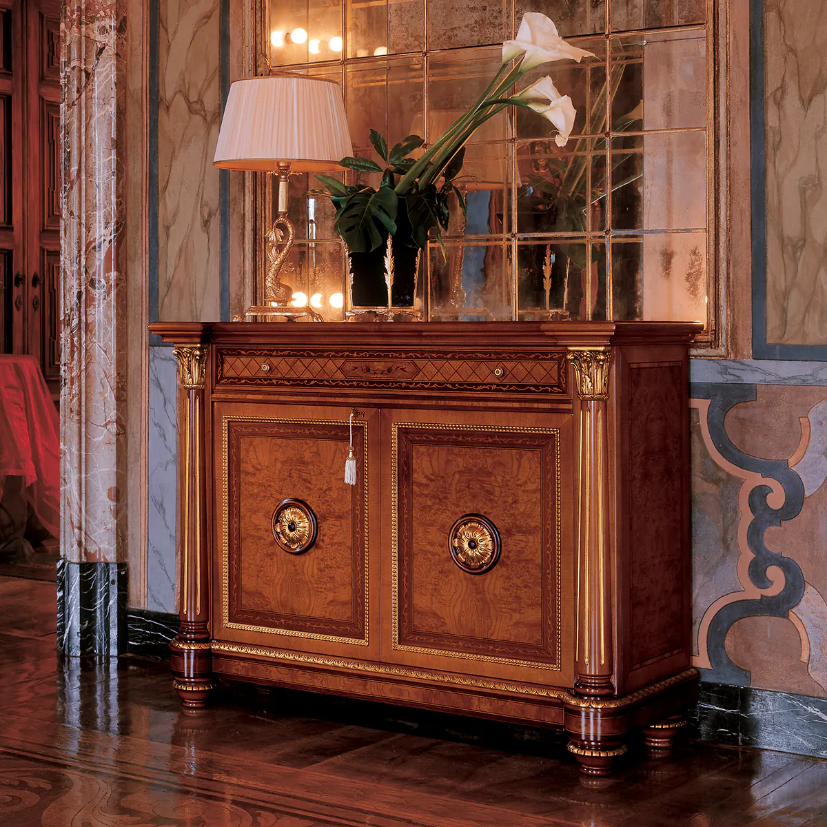 SENATOR sideboard 2 doors Elegant hand-crafted Senator sideboard 2 doors, adorned with a lamp and flowers, in a luxurious villa interior.