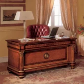 Luxurious handcrafted Senator writing desk and leather chair in an elegant office setting.