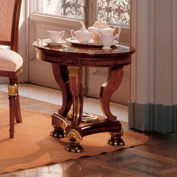 Elegant handcrafted Senator round coffee table with tea set, perfect for luxurious villa interiors.