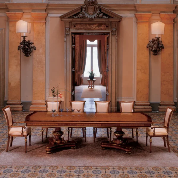 Elegant handcrafted Senator dining table with 2 pedestals in an opulent villa interior.
