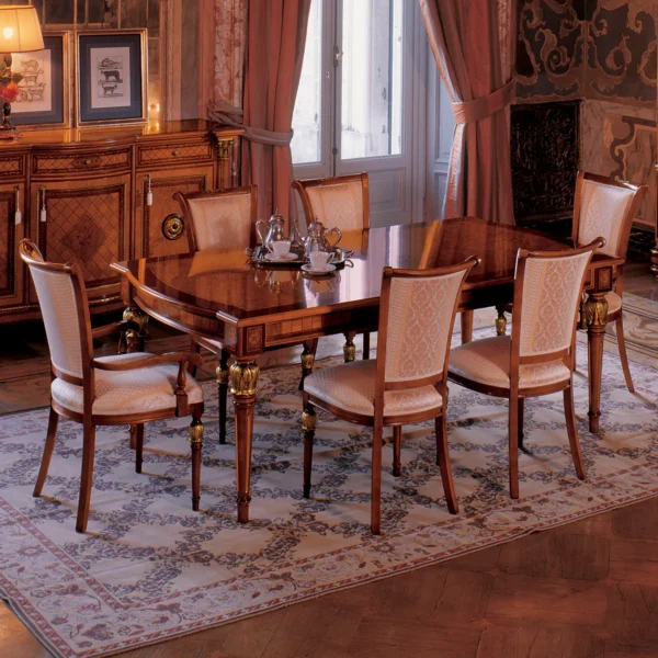 Elegant handmade Senator dining table set in a luxurious room with intricate woodwork and regal decor.