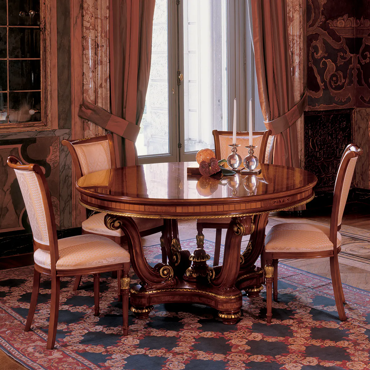SENATOR round table with pedestal Elegant handcrafted Senator round dining table with pedestal, in a luxurious Italian villa interior.