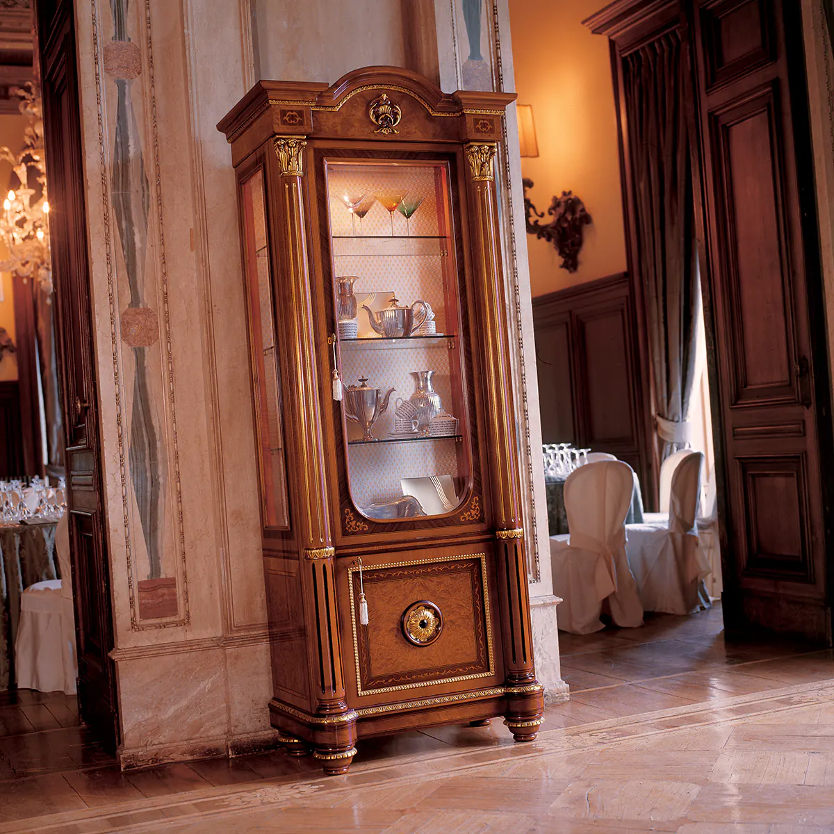 SENATOR display cabinet 1 door Elegant handmade Senator display cabinet 1 door in a luxurious villa interior, showcasing fine craftsmanship.