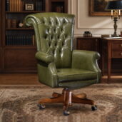 Classic green leather executive office chair with high tufted back, padded arms, wooden swivel base and casters